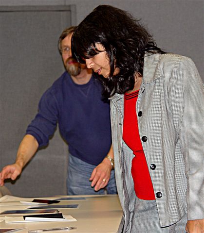 Guestspeaker Dr. Kulkarni checks out entries in the Astrophoto contest.